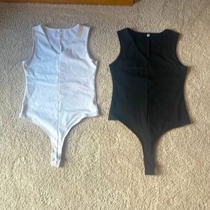Brand new ( no tags) small thong bodysuits, 1 black 1 white